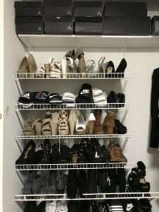 Shelves used for shoe storage in this organized closet.