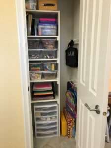 Organized craft room closet storage.