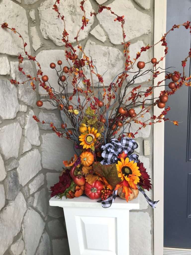 A closeup of a flower arrangement with sunflowers.