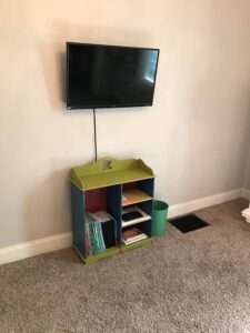 Bookshelf and entertainment area.