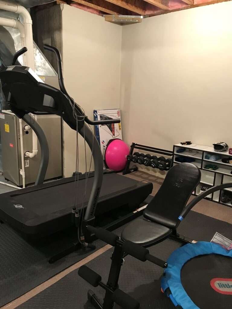 Organized basement workout area.