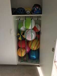 Inflatable ball storage in a playroom.