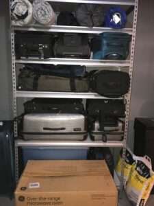 Organized luggage and travel storage in the basement.