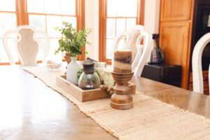 Close up of dining table runner with natural décor.